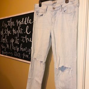 | Distressed light wash jeans |